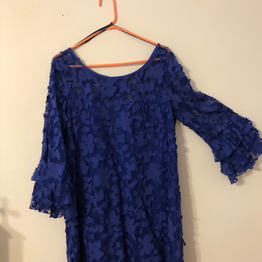 Bluish purple dress. Above knee.